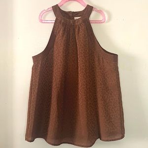 Brand new sleeveless blouse with subtle animal print